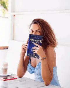 mockup-of-a-woman-holding-a-book-close-to-her-face-m9370-r-el2 (1)