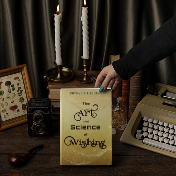 mockup-of-a-woman-holding-a-hard-cover-book-featuring-vintage-objects-m23709